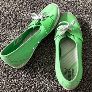 Green flat puma shoes